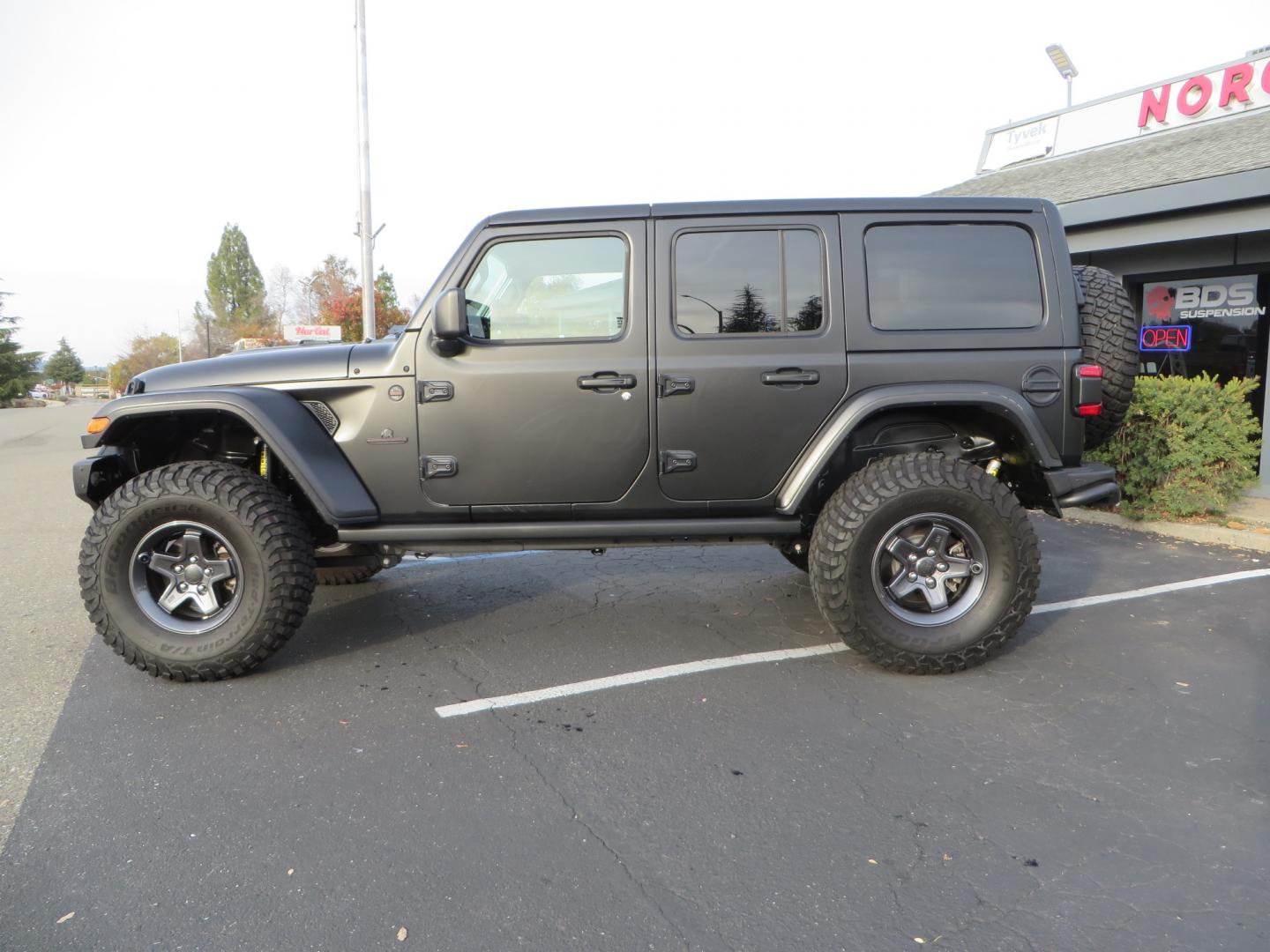 2020 BLACK /BLACK Jeep Wrangler Unlimited Rubicon (1C4HJXFGXLW) with an 3.6L V6 DOHC 24V FFV engine, 6A transmission, located at 2630 Grass Valley Highway, Auburn, CA, 95603, (530) 508-5100, 38.937893, -121.095482 - STANDARD CONTENT AEV RX Front Bumper AEV Front Skid Plate AEV Non-Winch Cover Plate AEV 7000 Series Lights AEV Light Cover Kit AEV 2.5" DualSport RT Suspension System AEV Front Geometry Correction Brackets AEV Steering Stabilizer AEV Rear Bumper AEV Swing-Out Tire Carrier AEV CHMSL Mount - Photo#7